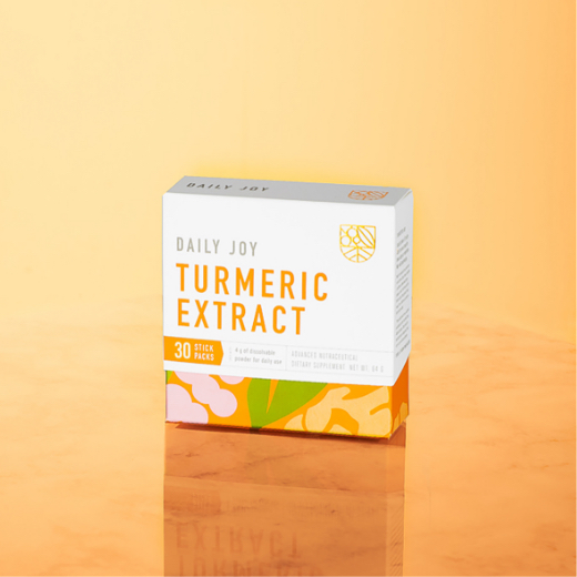 Box of Daily Joy Turmeric Extract on a glossy surface